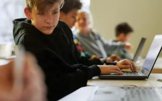 boy in IT classroom